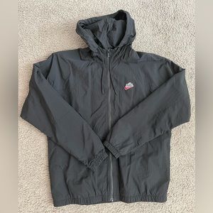 Small mens Nike Jacket. Slightly worn. Black